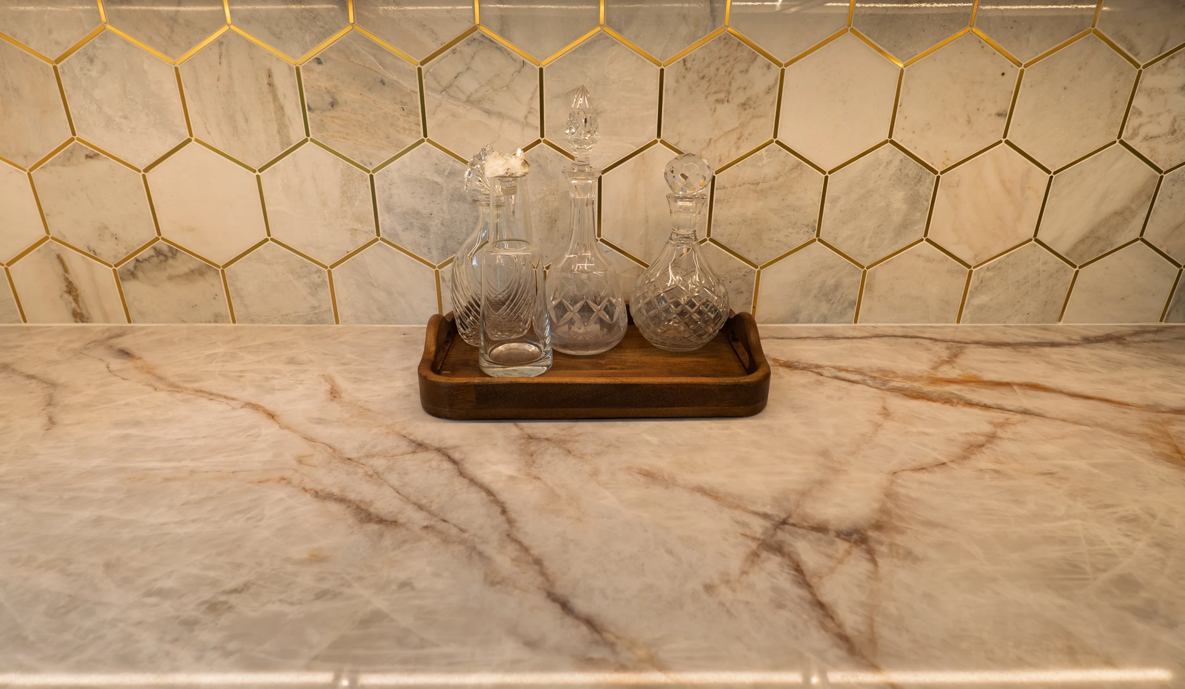 Marble hexagon bar backsplash with brass inlay detail, Portland OR kitchen remodel